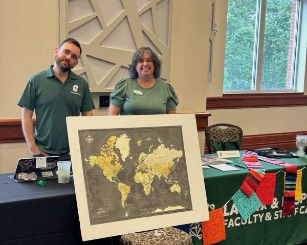 The photo shows Denis Jacob Machado and Adriana Medina at the 2025-2026 New Faculty Resource Fair.